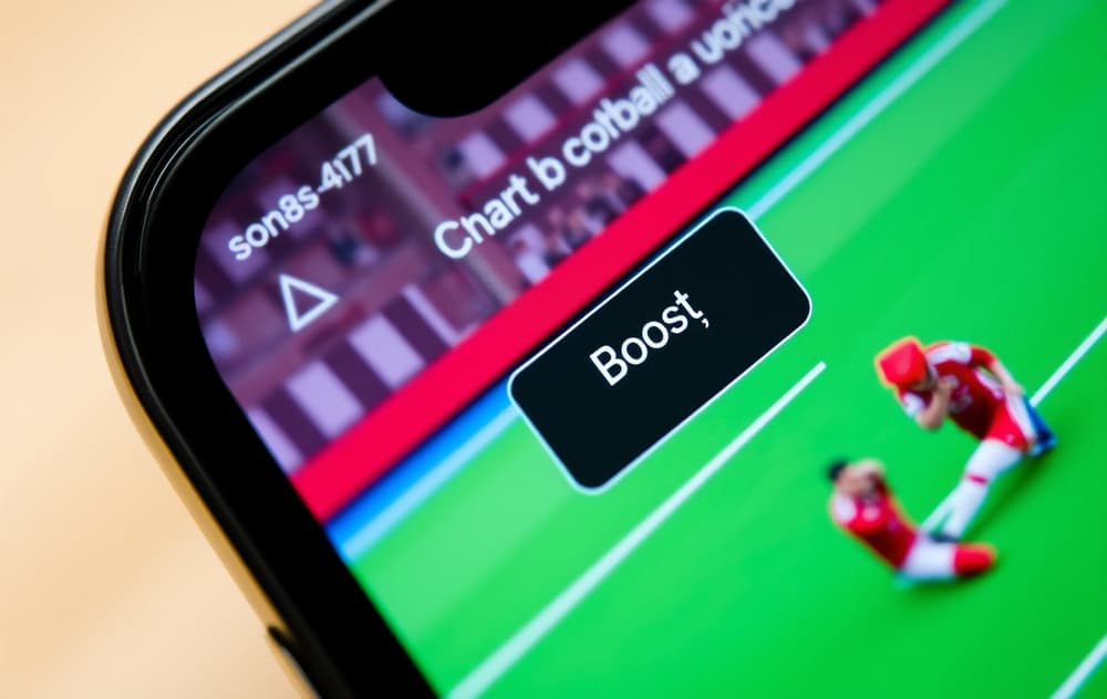 Smarttelefon med oddsboost-funksjon for fotballkamp